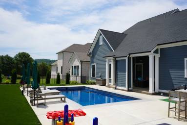 Modern house with outdoor swimming pool and patio