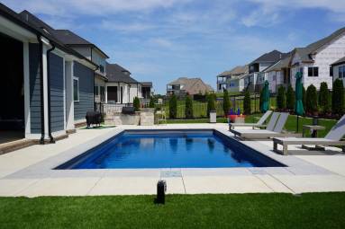 Backyard with swimming pool and modern houses